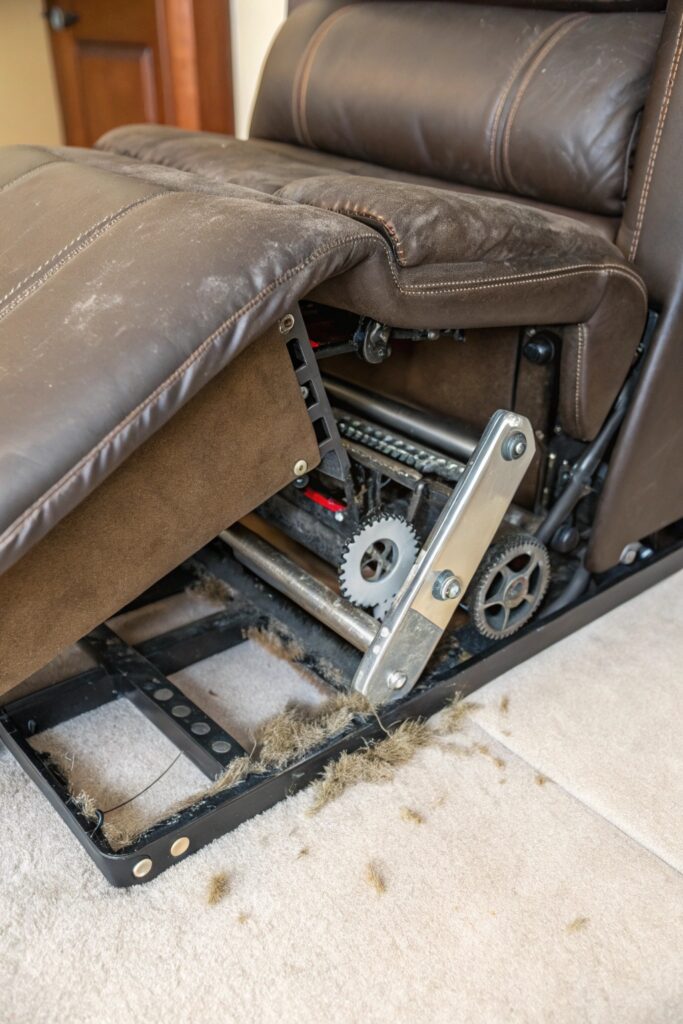 10 Reasons a Recliner Footrest Is Too Hard to Close (and Easy Fixes) dirt debris buildup recliner mechanism