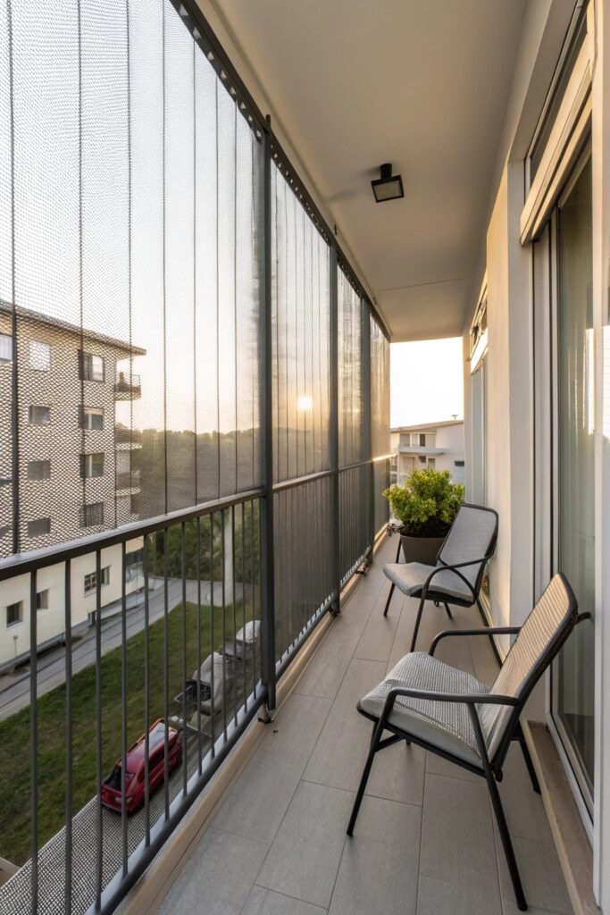 12 Apartment Balcony Privacy Ideas for a Cozy Outdoor Retreat retractable privacy screen balcony